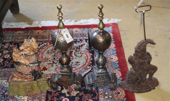 A pair of Punch and Judy door stops (one painted) and a pair of Dutch style fire dogs with sphere finials, firedogs width 20cm, depth 4